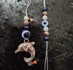 esmi-evel-eye-dolphin-rakhi-combo.jpg Esmi?- *Evel eye - Dolphin Rakhi Combo*