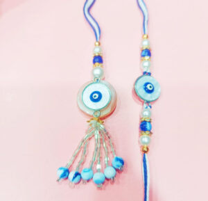 esmi-evil-eye-bhai-bhabi-rakhi-set.jpg Esmi?- *Evil eye Bhai Bhabi Rakhi Set*