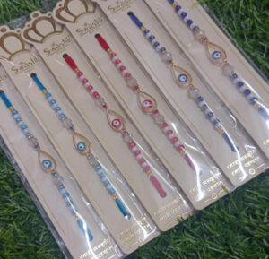esmi-evil-eye-rakhi.jpg Esmi?- *Evil Eye Rakhi*